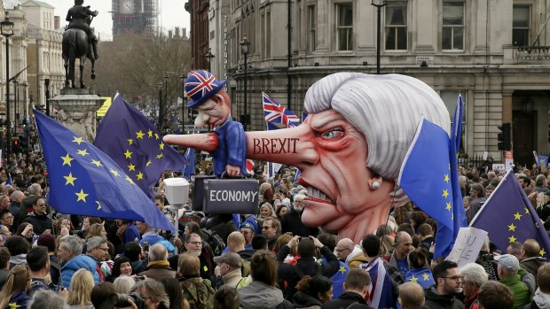An effigy of British Prime Minister Theresa May is wheeled through Trafalgar Square during a people's vote anti-Brexit march in London.