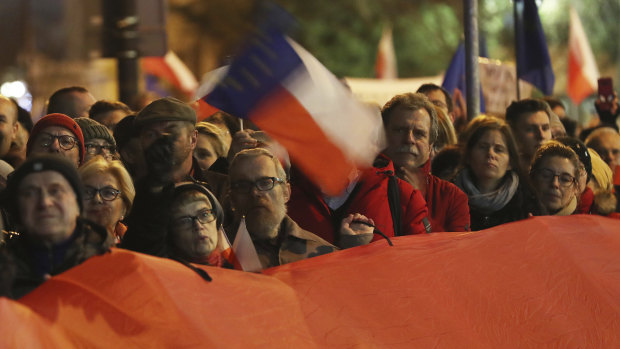 Demonstrators hold a rally to protest against changes to Poland's judiciary in Warsaw on Wednesday evening.