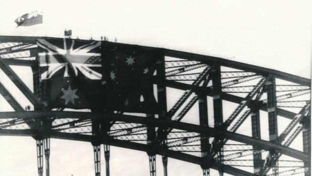The Australian flag draped over the Sydney Harbour Bridge to celebrate the America's Cup win.