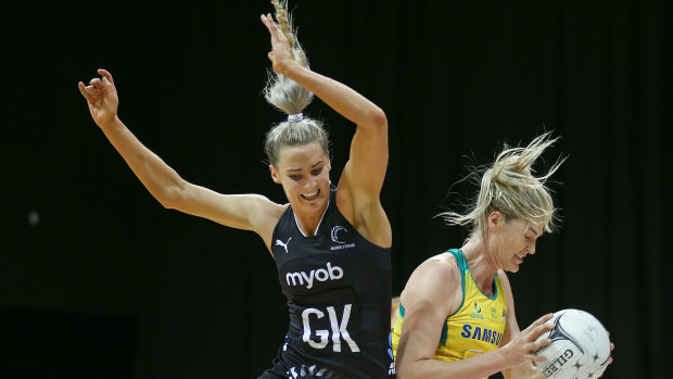 Support role: Australian captain Caitlin Bassett goes up against Jane Watson of New Zealand.