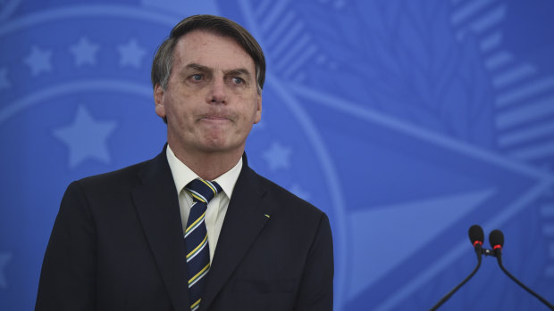 Brazilian governors and health authorities are at odds with President Jair Bolsonaro, above. Bolsonaro has called the pandemic a momentary, minor problem, saying strong measures to contain it are unnecessary.