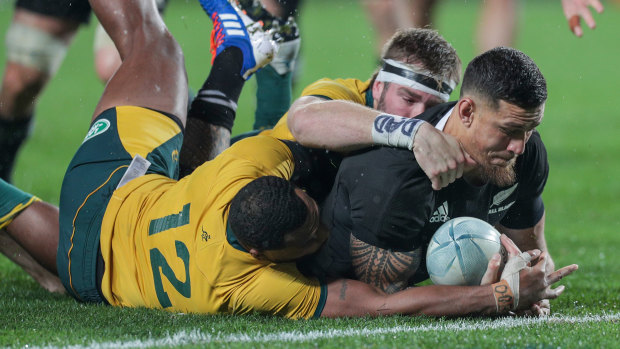 Vain effort: Samu Kerevi and Izack Rodda try to stop Sonny Bill Williams scoring.