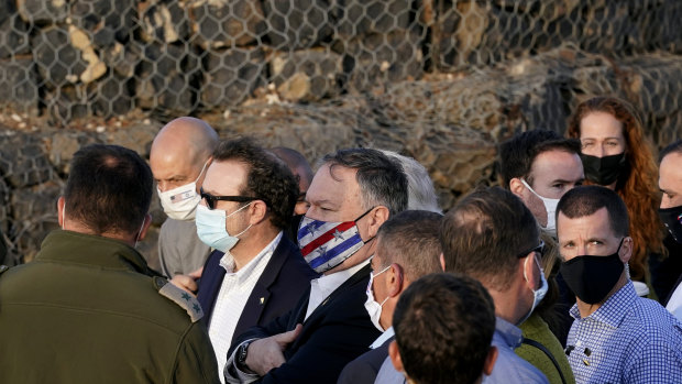 Secretary of State Mike Pompeo, centre, takes part in a security briefing on Mount Bental in the Israeli-controlled Golan Heights, near the Israeli-Syrian border.