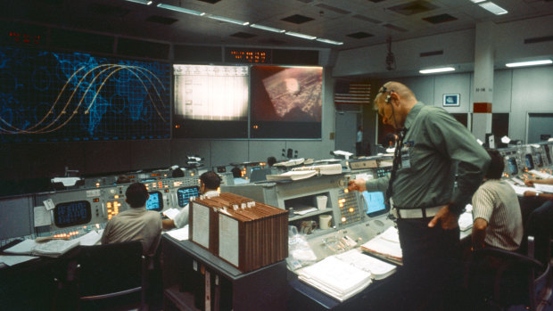 Eugene F. Kranz oversees the Soyuz-Apollo space docking mission from the control room in Houston, July 17, 1975. 