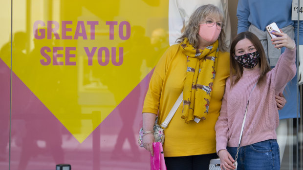 Two shoppers welcome the reopening of non-essential retail in Wales in April.