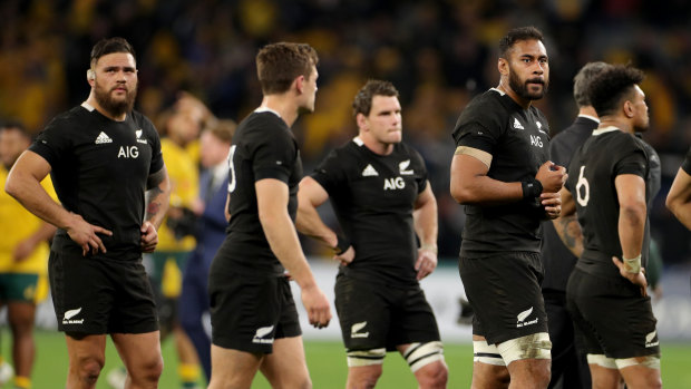 Bitter pill: The All Blacks look on after a rare domination by Australia.