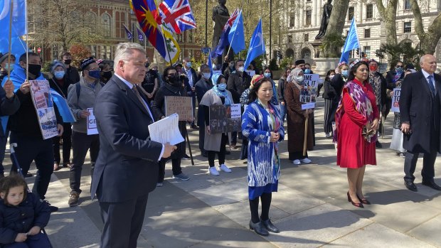 Rahima Mahmut from the World Uighur Congress with Conservative MPs Nus Ghani and Sir Iain Duncan Smith in London address a gathering before the genocide vote.