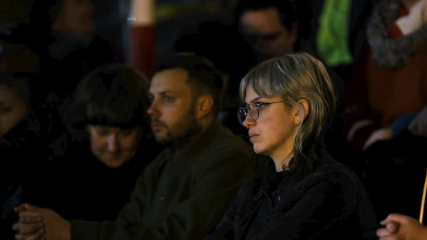 People attend a vigil for Natalina Angok at Parliament House, Melbourne, on Friday.