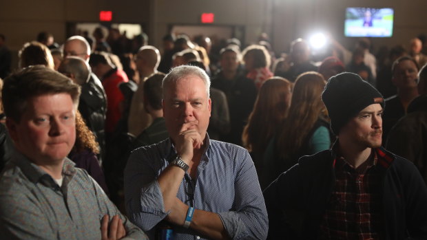 Joe Biden supporters wait for results during a caucus night watch party in Des Moines, Iowa.