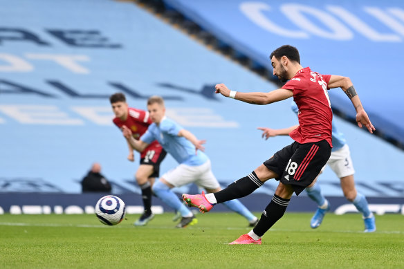 Bruno Fernandes scores for Manchester United against Manchester City.