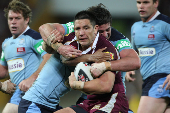 Trent Waterhouse tackles Steve Price before the fireworks erupt.