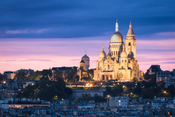 Marvel at the top of the steps at Sacre Coeur before enjoying dinner at Montmartre.