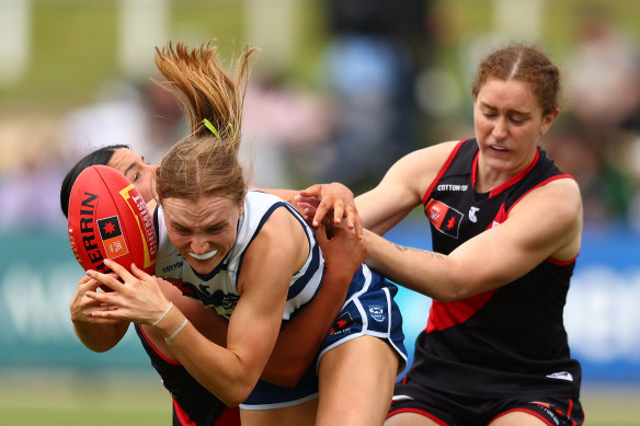Geelong’s Zali Friswell is tackled in Essendon’s win.