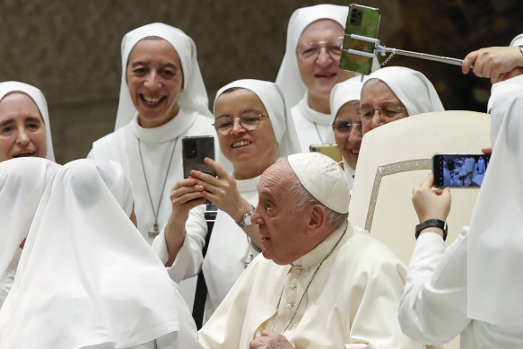Pope Francis greets a group of nuns at the end of his weekly general audience at the Vatican on August 17.