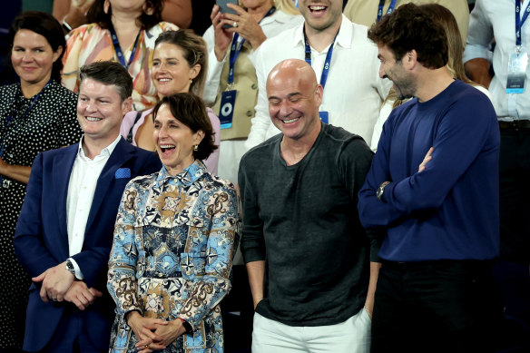 Andre Agassi (centre right) attends the opening day of the Australian Open with acting Victorian premier Ben Carroll (left) and Tennis Australia chairman Jayne Hrdlicka. 