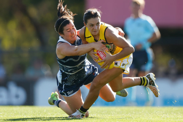 Monique Conti is tackled by Geelong’s Rachel Kearns.