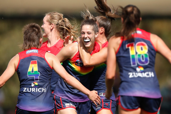 Lauren Pearce, centre, celebrates a goal. 