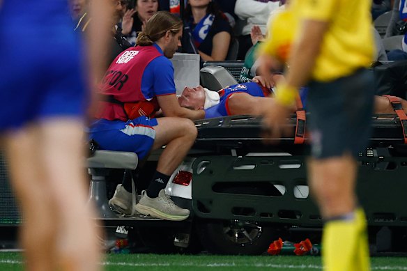 Aaron Naughton was cleared of serious injury after a sickening fall in the Bulldogs’ loss to Sydney.