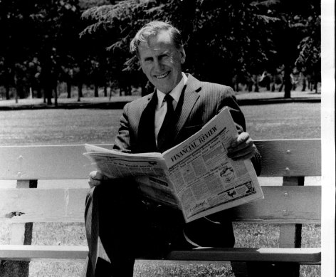 Dalrymple, then Australia’s ambassador in Washington, reading the Australian Financial Review in a Canberra park in 1986.