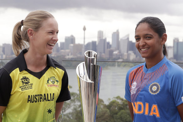 Australia's Meg Lanning and India's Harmanpreet Kaur with the Twenty20 World Cup.