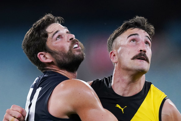 Carlton's Levi Casboult and Richmond's Ivan Soldo compete for the ball in front of ... nobody.