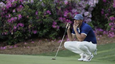 Brooks Koepka considers a putt at the 13th hole at Augusta.