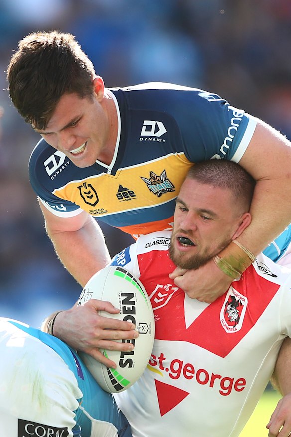 Matt Dufty is collared by the Gold Coast defence.