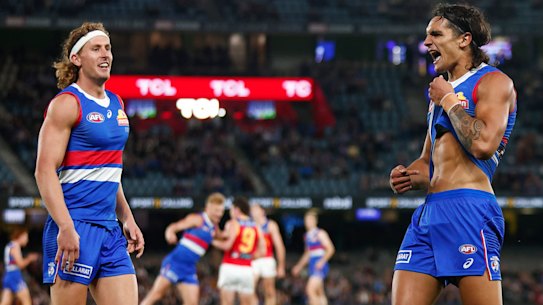 MELBOURNE, AUSTRALIA - MARCH 30: Jamarra Ugle-Hagan of the Bulldogs (R) celebrates kicking a goal during the round three AFL match between Western Bulldogs and Brisbane Lions at Marvel Stadium, on March 30, 2023, in Melbourne, Australia. (Photo by Daniel Pockett/Getty Images)