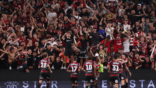 The Red and Black Bloc revel in Amor Layouni’s second goal.