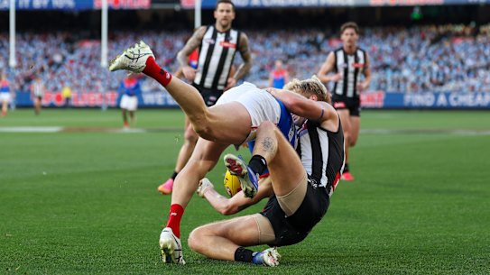 Brody Mihocek was caught in a tackle by former teammate Billy Frampton. 