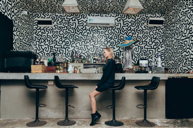 The hand-painted work of pop artist Keith Haring adorns the walls of Haring Bar.