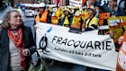 Macquarie Bank customers and shareholders, together with a coalition of environment and civil society organisations, protest outside 1 Elizabeth Street, Sydney, before Macquarie’s AGM.