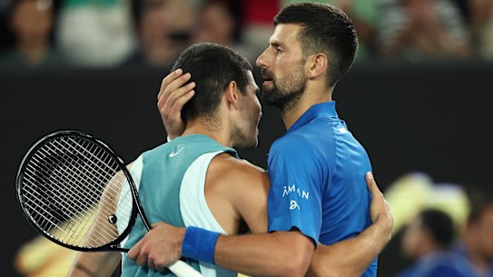 Novak Djokovic embraces Carlos Alcaraz after their quarter-final.