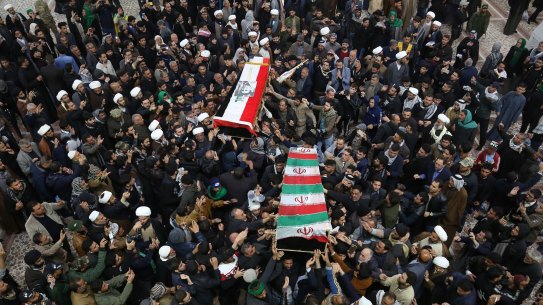 Mourners in Baghdad carry the coffins of Iran's General Qassem Soleimani and Mahdi al-Muhandis, the Iraqi deputy commander of Iran-backed militia.