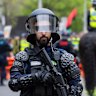 Police at a March for Australia rally in Melbourne in October.