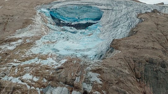 A large chunk of the glacier in Italy’s Alps near Trento in the Dolomite ranges broke loose, unleashing an avalanche that killed at least six hikers and injured eight others.