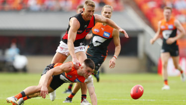 Dyson Heppell and Xavier O’Halloran fight for the footy.