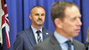 Chief Minister Andrew Barr stands behind Greens leader Shane Rattenbury at an event marking two years of their parliamentary agreement. The Greens are now threatening to vote down Mr Barr's CTP bill unless changes are made. 