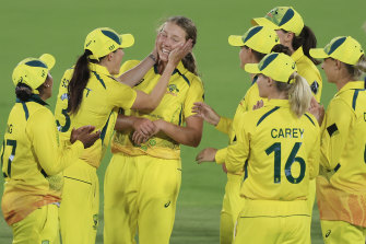 Megan Schutt co<em></em>ngratulates Darcie Brown on one of her four World Cup wickets against England.