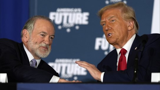 President Donald Trump talks with US ambassador to Israel Mike Huckabee before both men assumed their current roles 2024.