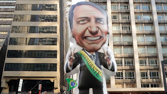 Supporters of Jair Bolsonaro, presidential candidate for the National Social Liberal Party who was stabbed during a campaign event, exhibit a large, inflatable doll in his image to show support for him, in Sao Paulo, Brazil.
