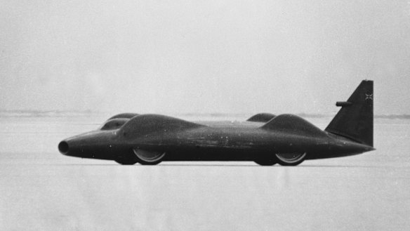 The Bluebird speeds over the salt surface of during a trial run.