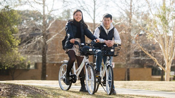 Lucy Xu and Michael Ma are some of the first users of Airbike in Canberra since it rolled out last week.