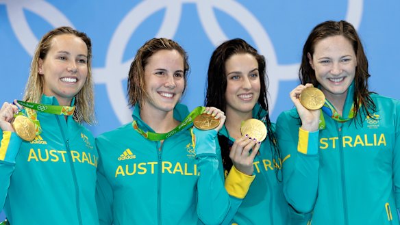 Golden girls ... Australia’s Emma McKeon, left, Bronte Campbell, second left, Brittany Elmslie, second right, and Cate Campbell, right, show off their gold medals during the ceremony for the women’s 4x100-metre freestyle at the 2016 Olympics.