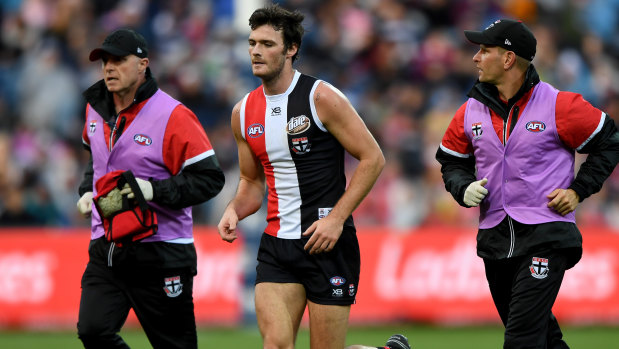 Season over: St Kilda's Dylan Roberton comes off in Round 4 after collapsing against the Cats in Geelong.