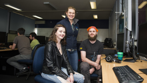 The Canberra Technology Park will be sold off to the Academy of Interactive Education for a redevelopment. AIE student Sian Sallway, AIE planning and implementation manager Casey Gregory, and AIE student Pop Jadric. 