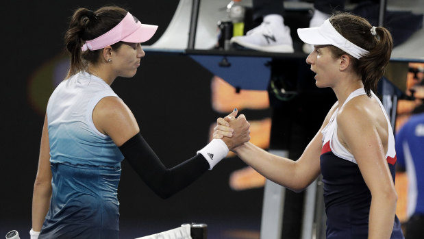 Muguruza (left) is congratulated by Konta at the end of the match.