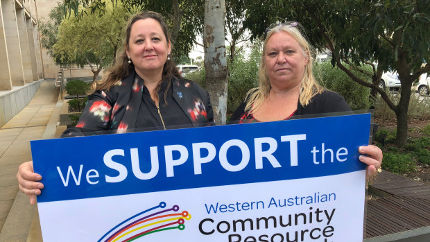 Cate Rocchi and Lee Steel protesting the state government's cuts to regional Community Resource Centres after Treasurer Ben Wyatt brought down the state budget on Thursday.