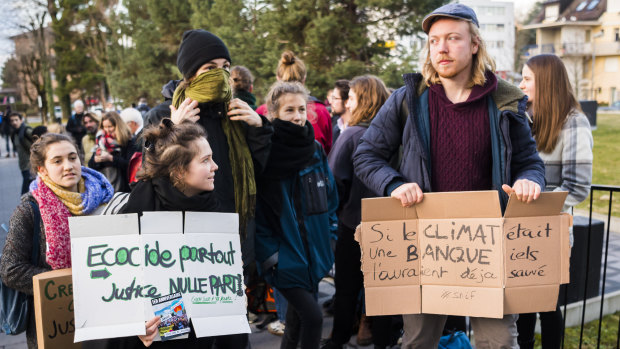People demonstrate in Renens, Switzerland in support of the 12 activists of the Lausanne Action Climat collective at the opening of the trial against them for storming a Credit Suisse office in Saint-Francois in November 2018.
