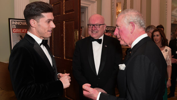 Prince Charles talks with Australian musical theatre star Josh Piterman and Australian High Commissioner George Brandis at the bushfire fundraiser. 